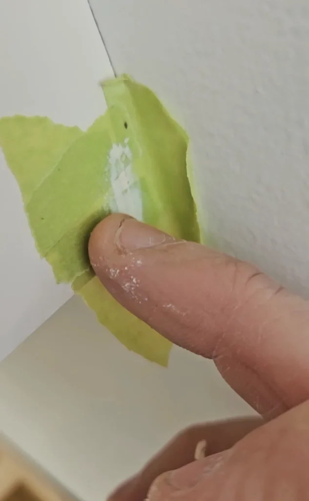 Colour matched putty for nail holes