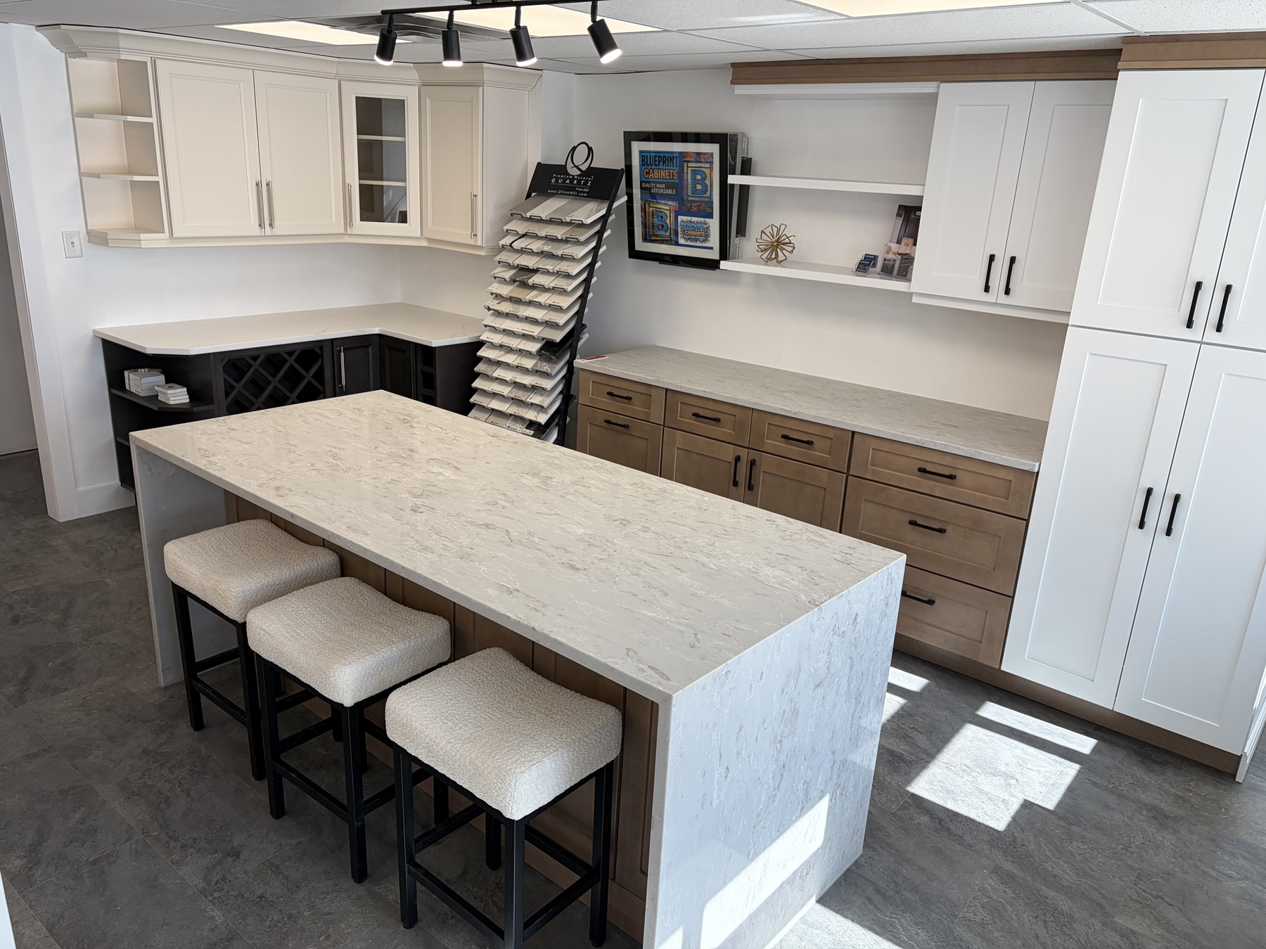Display kitchen and table inside the BluePrint Cabinets showroom