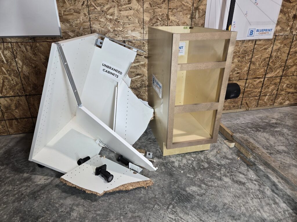 Destroyed particleboard cabinet beside an intact BluePrint plywood cabinet after the hammer test