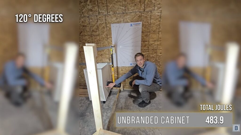 Particleboard cabinet cracking after the 120 degree hammer strike, 483.9 joules absorbed