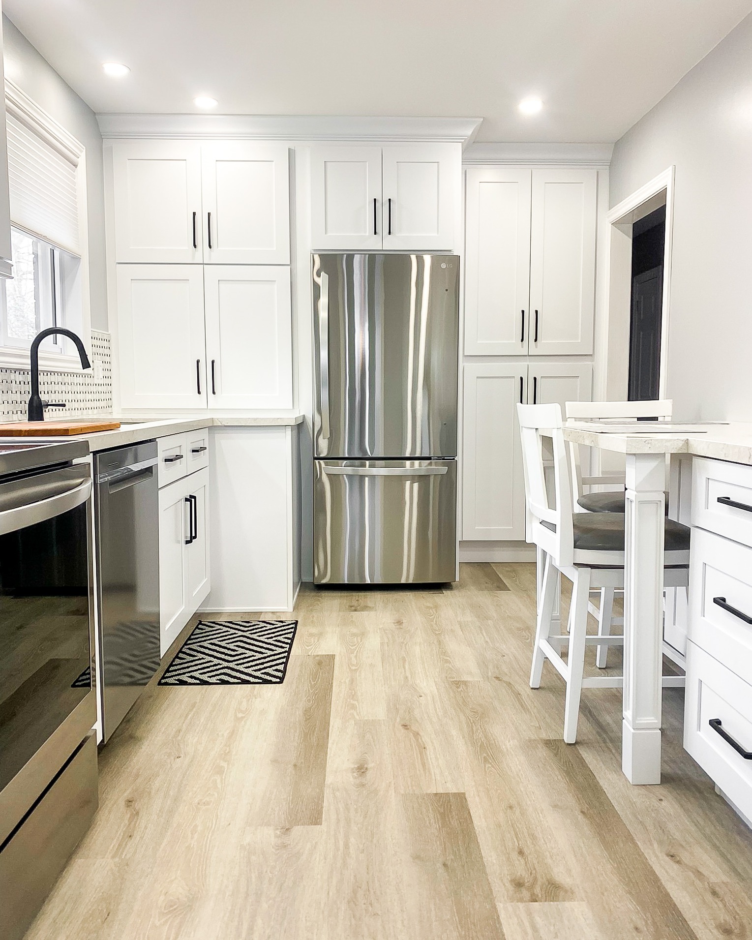 Door style, finish and hardware displays inside the BluePrint Cabinets Moncton showroom